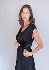 Image showing woman in a black dress isolated on white background