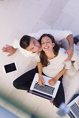 Image showing couple using tablet and laptop computers top view