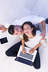 Image showing couple using tablet and laptop computers top view