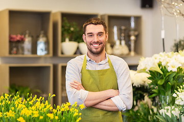 Image showing florist man or seller at flower shop counter