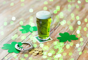 Image showing glass of green beer, horseshoe and gold coins