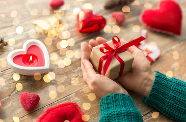 Image showing close up of hands holding christmas gift