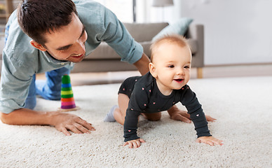 Image showing happy little baby girl with father at home