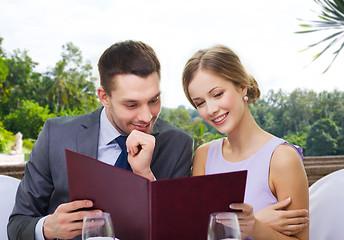 Image showing couple with menu at restaurant