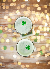 Image showing glasses of green beer with shamrock from top