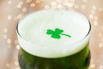 Image showing close up of glass of green beer with shamrock