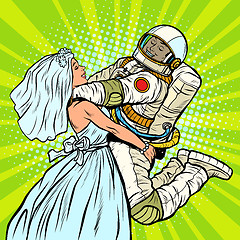 Image showing bride and groom at the wedding. astronaut and his wife