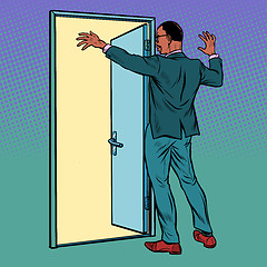 Image showing Pop art african man opens the door, greeting