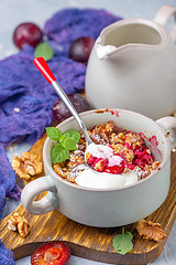 Image showing Red cherry plum crumble for healthy breakfast.