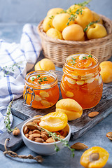 Image showing Homemade apricot jam with thyme and sweet almonds.