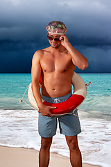 Image showing portrait of shirtless man standing at beach