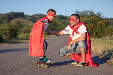 Image showing Father and son playing superhero at the day time.