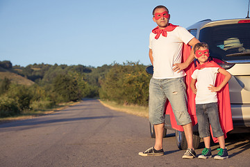 Image showing Father and son playing superhero at the day time.