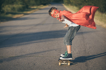 Image showing Happy little child playing superhero.