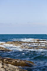 Image showing Blue sea water, stones and rocks on Adriatic sea coast.