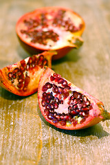 Image showing broken ripe pomegranate fruit and seeds