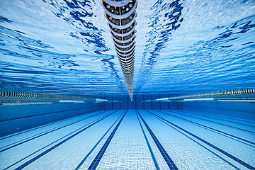 Image showing Olympic Swimming pool under water background.