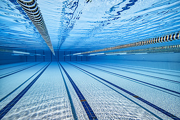 Image showing Olympic Swimming pool under water background.