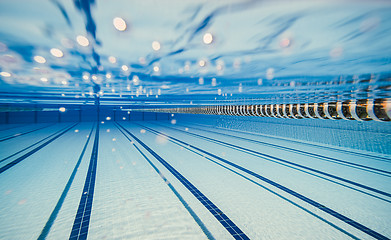 Image showing Olympic Swimming pool under water background.
