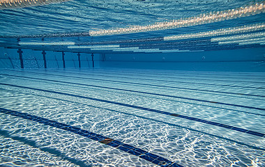 Image showing Olympic Swimming pool under water background.