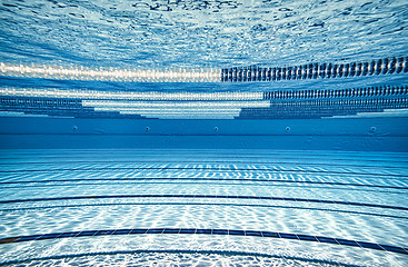 Image showing Olympic Swimming pool under water background.