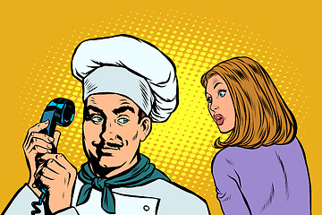 Image showing chef on the phone, a woman client listens