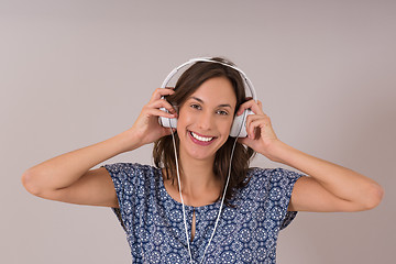 Image showing woman with headphones isolated on a white