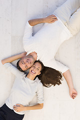 Image showing handsome couple lying on floor