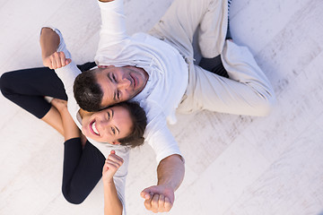 Image showing couple sitting with back to each other on floor