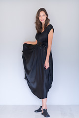 Image showing woman in a black dress isolated on white background