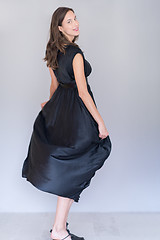 Image showing woman in a black dress isolated on white background