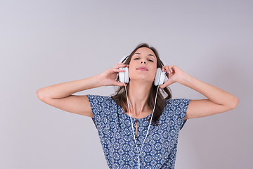 Image showing woman with headphones isolated on a white