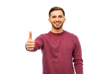 Image showing happy young man showing thumbs up