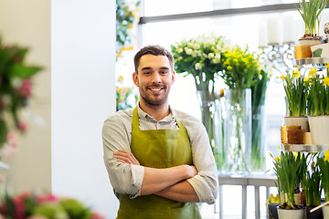 Image showing florist man or seller at flower shop counter