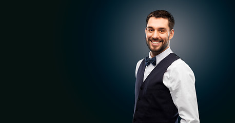 Image showing man in shirt and bowtie over black background