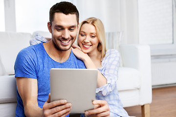 Image showing happy couple with computer at home