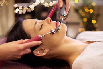 Image showing woman having hydradermie facial treatment in spa