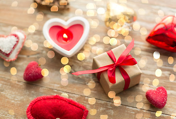 Image showing christmas gift, heart shaped decorations, candle