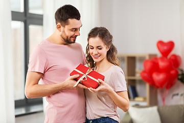 Image showing couple with gift box on valentines day at home