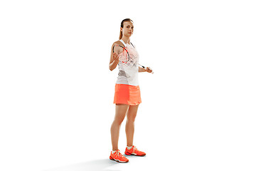 Image showing Young woman badminton player standing over white background