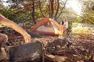 Image showing Party, camping of men and women group at forest. They relaxing