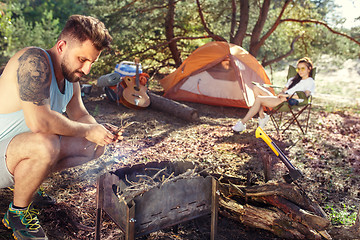 Image showing Party, camping of men and women group at forest. They relaxing