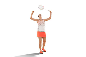 Image showing Young woman badminton player as winner posing over white background