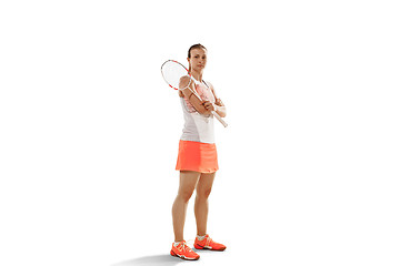 Image showing Young woman badminton player standing over white background