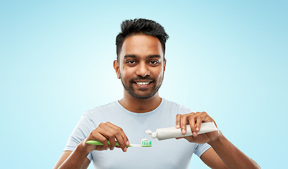 Image showing indian man with toothbrush and toothpaste