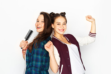 Image showing teenage girls singing to hairbrush and having fun