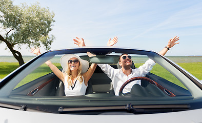 Image showing happy man and woman driving in cabriolet car