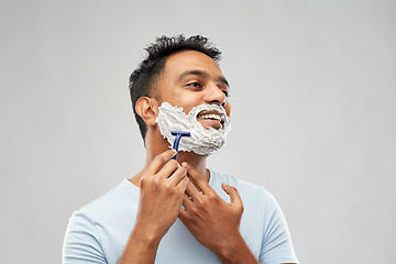 Image showing indian man shaving beard with razor blade