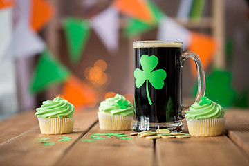 Image showing shamrock on glass of beer, green cupcake and coins