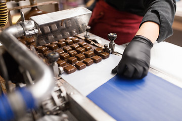 Image showing candies making by chocolate coating machine